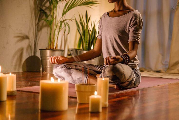 a woman meditating to avoid burn out